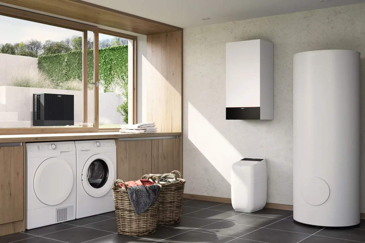 Modernes Hauswirtschaftszimmer mit weißer Wärmepumpe, Wäschetrockner und Waschmaschine in Dortmund
